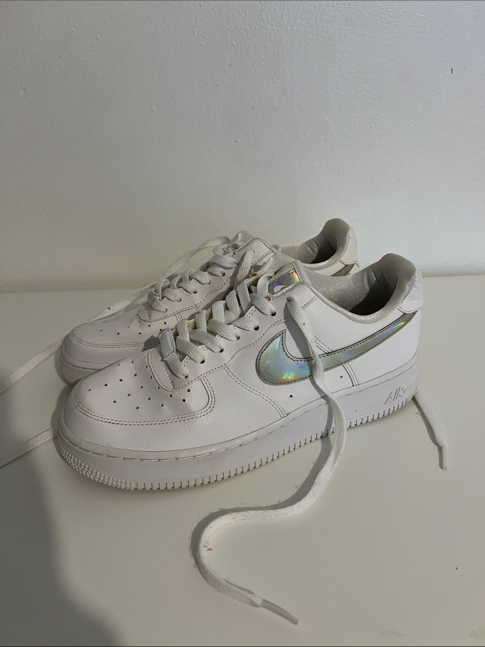 Nike White Low-Top Sneakers with Iridescent Swoosh